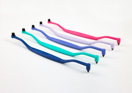 Five colorful two headed cat toothbrush